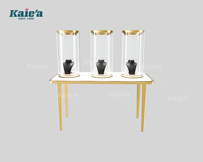 Luxurious jewelry display table with cylindrical glass display cabinets